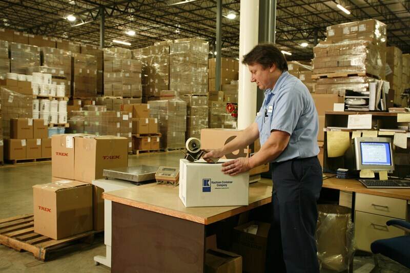 Kaufman Container employee handling the shipping of custom packaging in Cleveland, OH